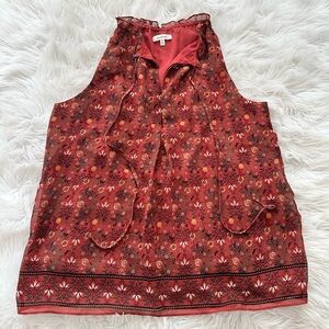 Red orange floral sleeveless blouse with adjustable neck ruffle